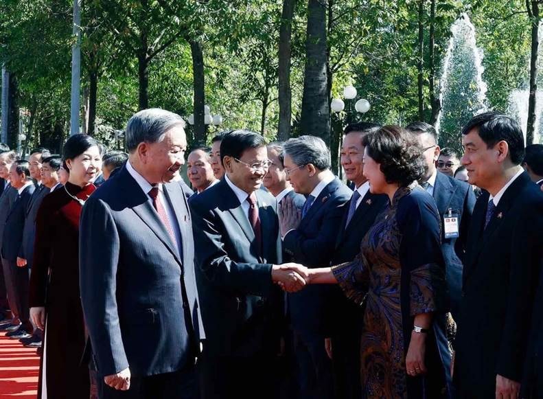 A group of people shaking handsAI-generated content may be incorrect.